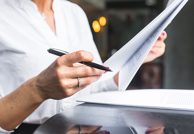 woman reviewing documents Bistline Law and Mediation, PLLC in Sandpoint, ID